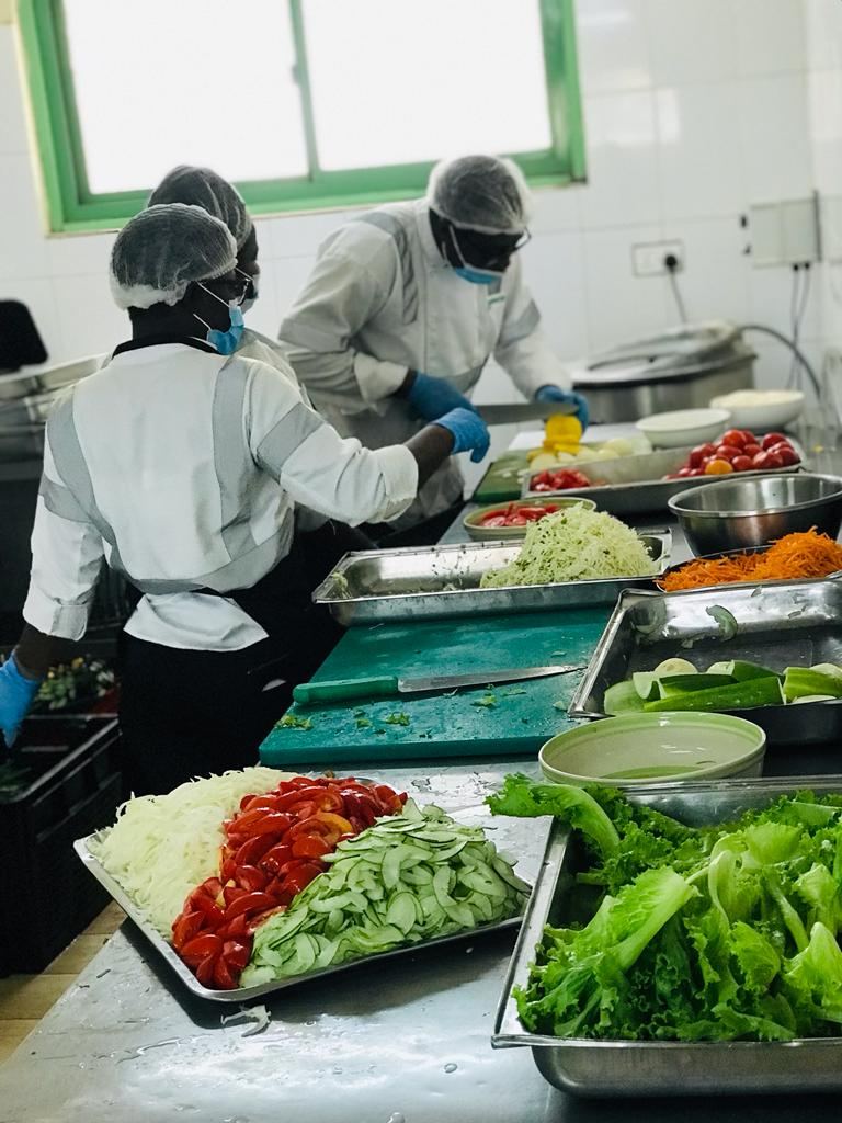 Germisa kitchen staff chopping fresh salad